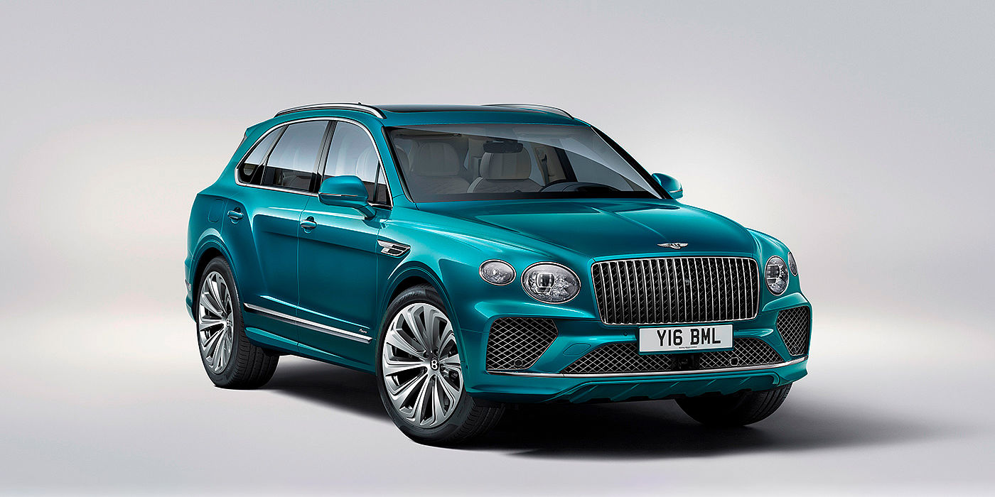 Bentley Baku Bentley Bentayga Azure front three-quarter view, featuring a fluted chrome grille with a matrix lower grille and chrome accents in Topaz blue paint.