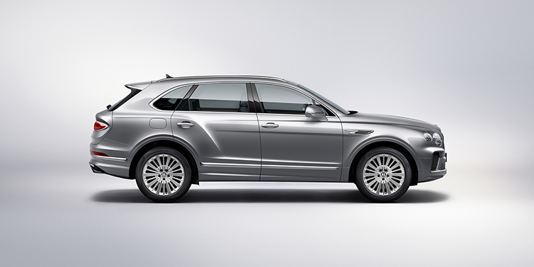 Bentley Baku Bentley Bentayga SUV side profile in Moonbeam silver paint against white background featuring 21 inch 5 spoke wheels